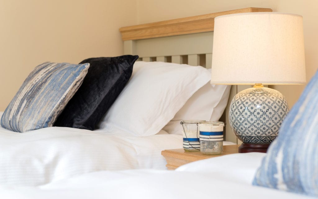 Soft sheets and plump pillows on luxury caravan holidays in Devon