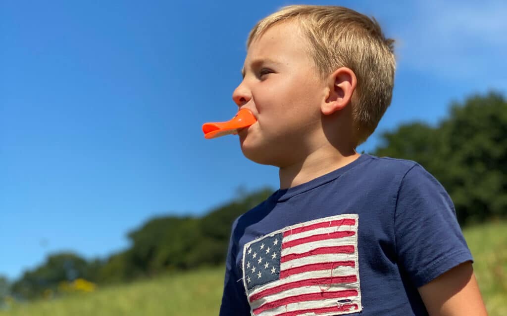 Boy Playing With Quacker Toy For Covid