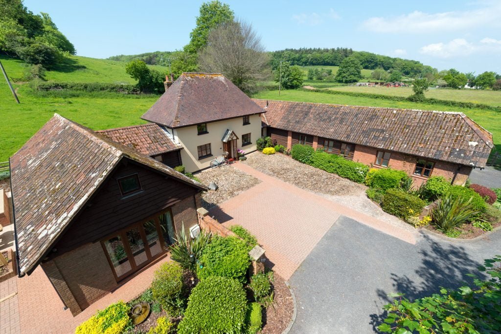 Exteriors of Cofton's Woodside holiday cottages